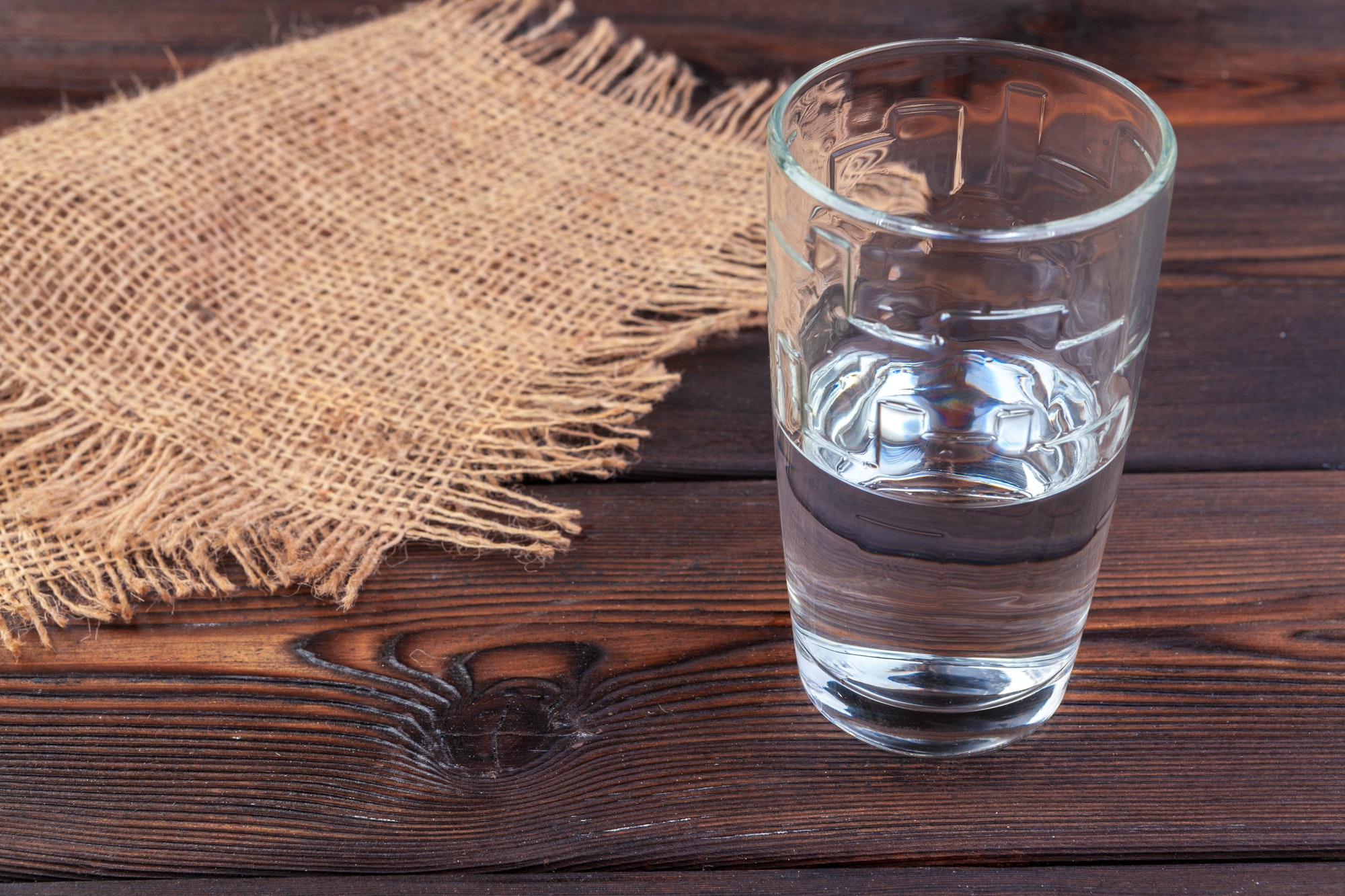 Glasses of water on a wooden table